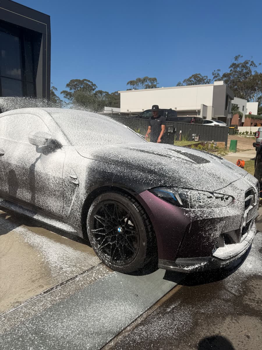 BMW M4 covered in snow foam